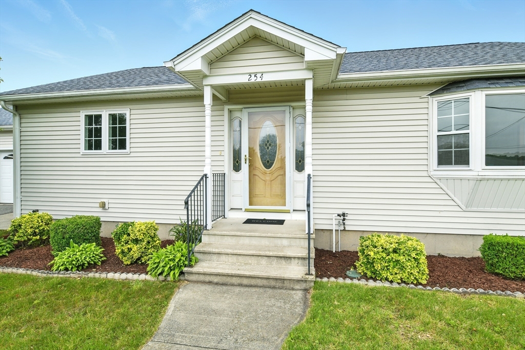254 Island Pond Road Springfield, MA 01118 - Photo 3 of 26 a front view of a house with a yard