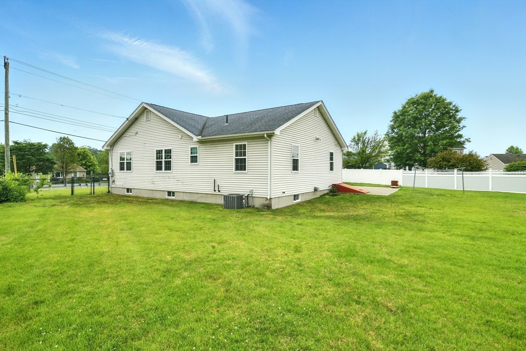 254 Island Pond Road Springfield, MA 01118 - Photo 5 of 26 a view of a house with a backyard
