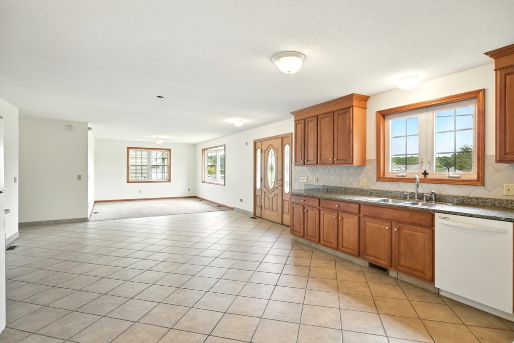 254 Island Pond Road Springfield, MA 01118 - Photo 9 of 26 a view of a kitchen with a sink and a window