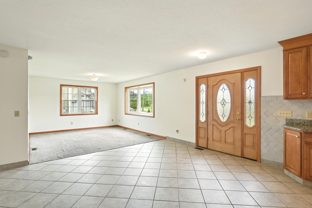 254 Island Pond Road Springfield, MA 01118 - Photo 10 of 26 an empty room with windows
