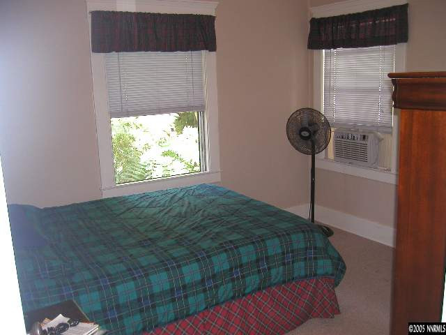 403 Roberts Street Reno, NV 89502 - Photo 5 of 9 a bedroom with a bed and a window