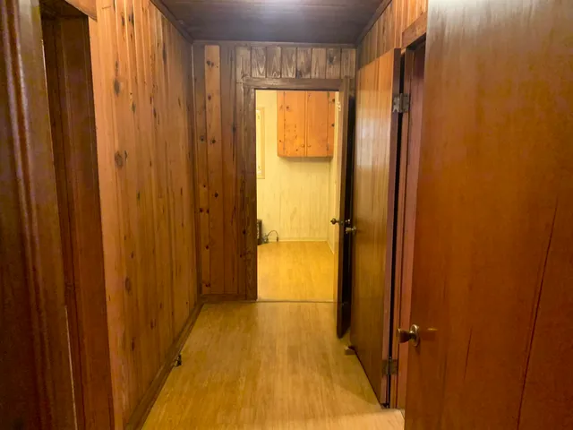 a view of a bathroom with a wooden door