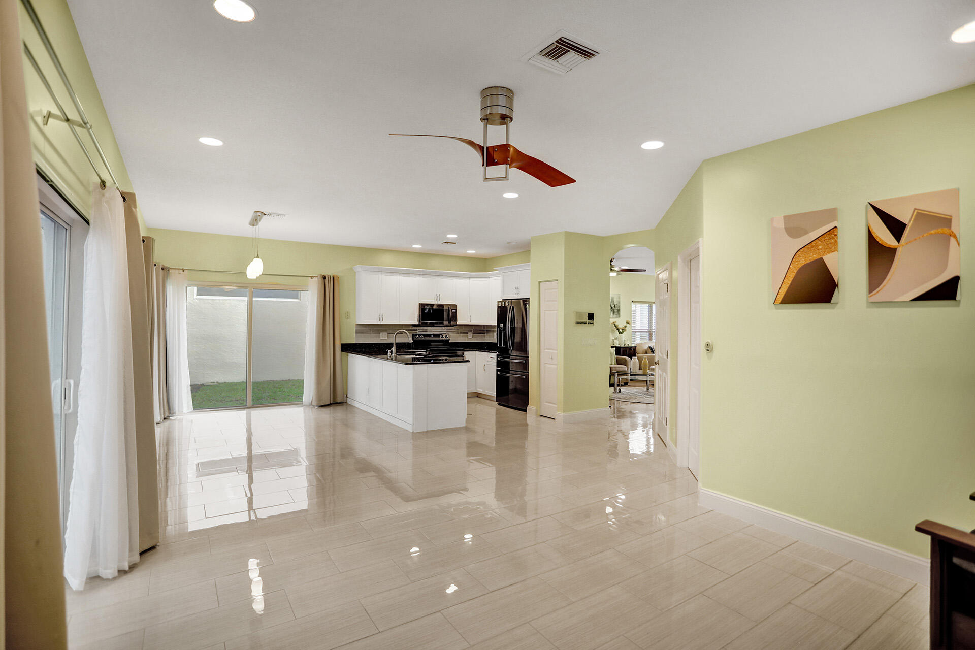 7214 Panache Way Boca Raton, FL 33433 - Photo 5 of 17 7214 panache way family rm and kitchen