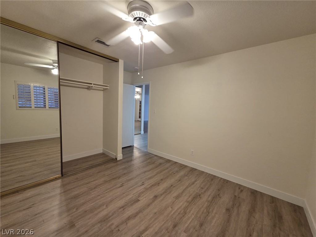 3317 Racquet Street Las Vegas, NV 89121 - Photo 12 of 23 Bright and airy bedroom with stylish flooring and ample storage.