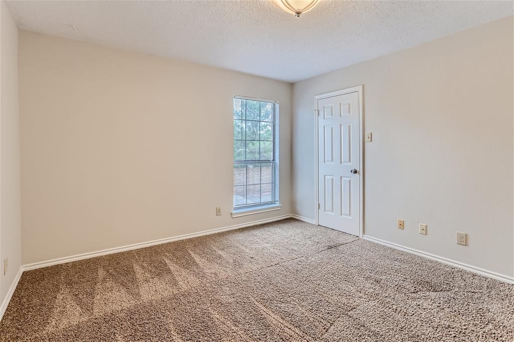 16301 Ledgemont Lane, Unit 269 Addison, TX 75001 - Photo 13 of 22 a view of an empty room and window