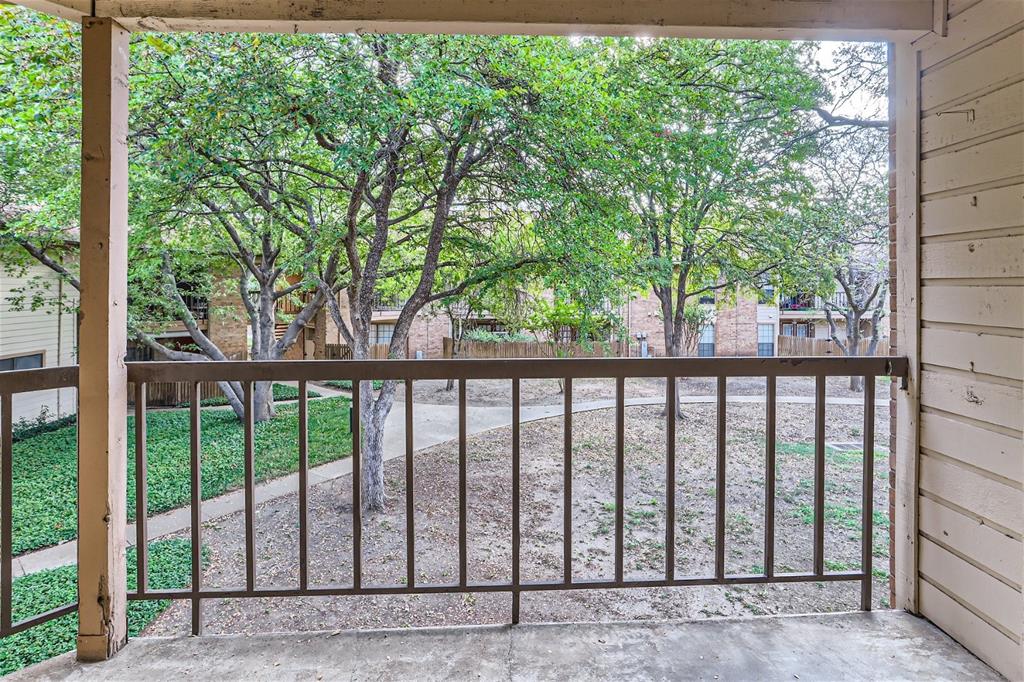 16301 Ledgemont Lane, Unit 269 Addison, TX 75001 - Photo 17 of 22 a view of a wooden fence