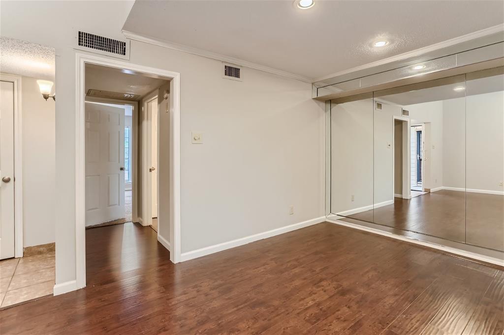 16301 Ledgemont Lane, Unit 269 Addison, TX 75001 - Photo 10 of 22 a view of a hallway with wooden floor