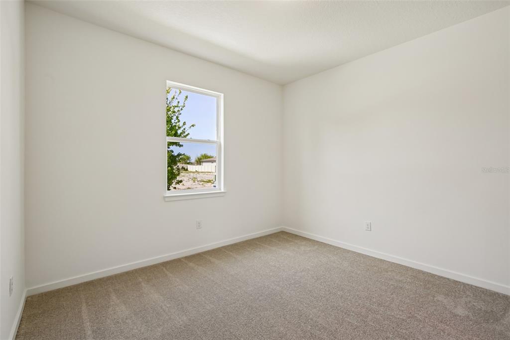 9932 Redwood Rdg Avenue Riverview, FL 33578 - Photo 23 of 38 an empty room with windows