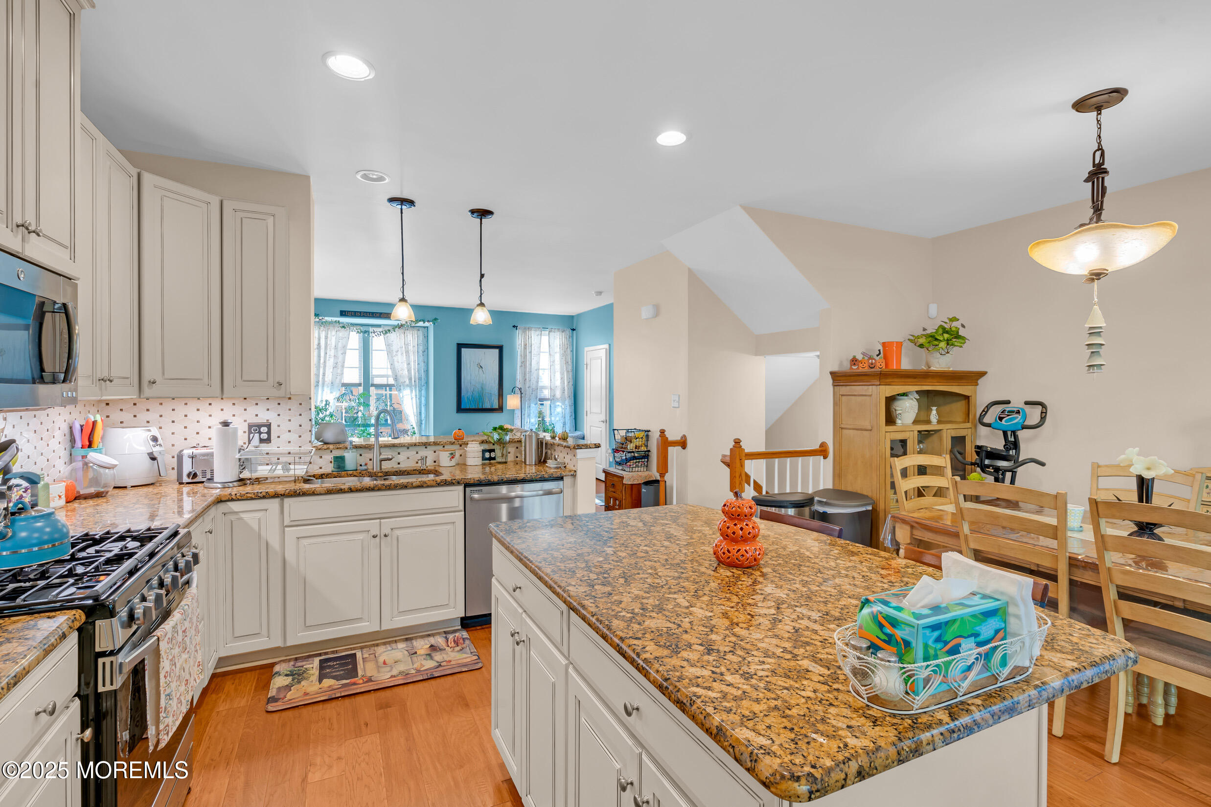 111 Spirit Way Brick, NJ 08723 - Photo 11 of 39 a kitchen with stainless steel appliances granite countertop a sink stove and refrigerator