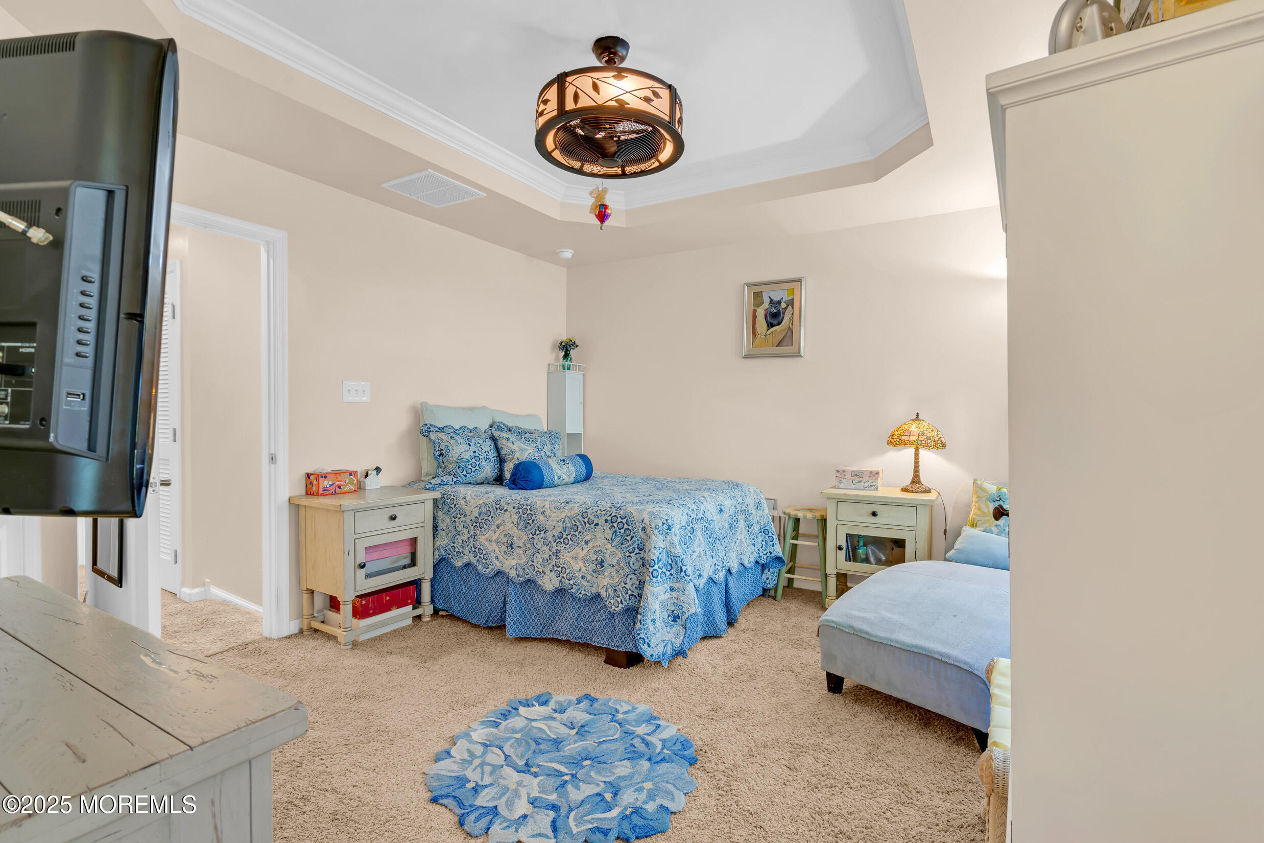 111 Spirit Way Brick, NJ 08723 - Photo 17 of 39 a bedroom with bed and a chandelier