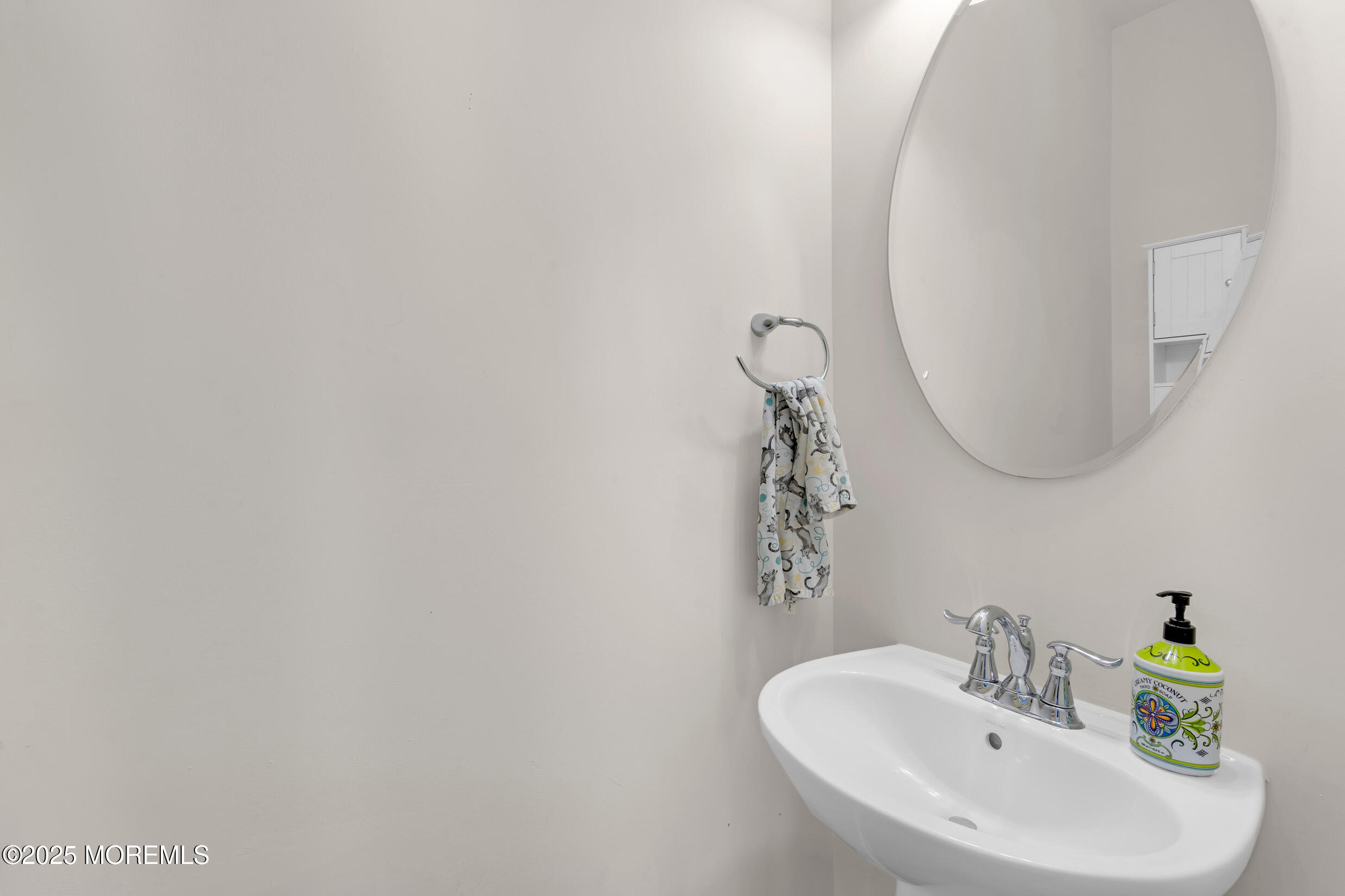 111 Spirit Way Brick, NJ 08723 - Photo 24 of 39 a bathroom with a sink and a mirror