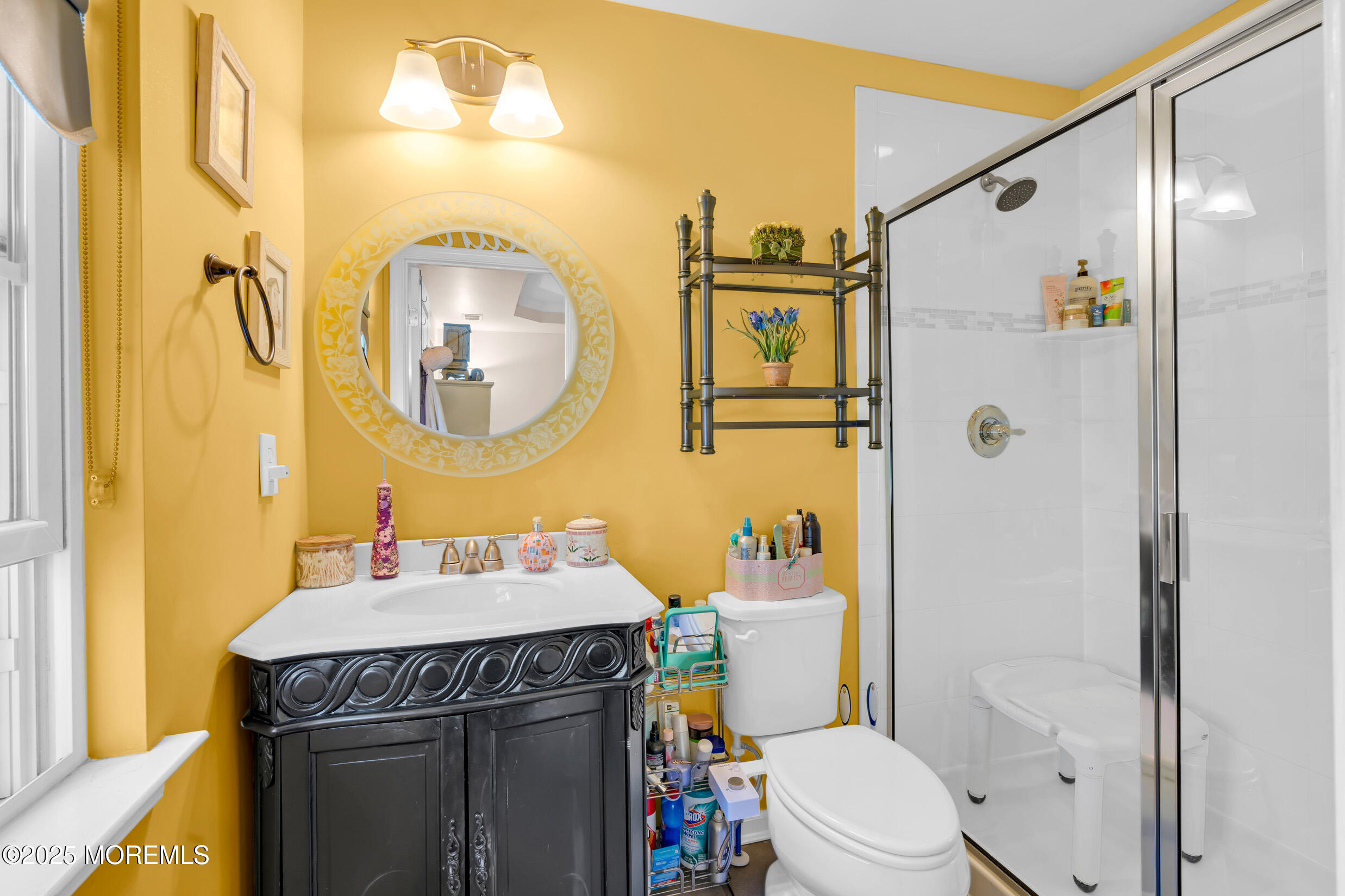111 Spirit Way Brick, NJ 08723 - Photo 25 of 39 a bathroom with a sink a toilet and shower curtain