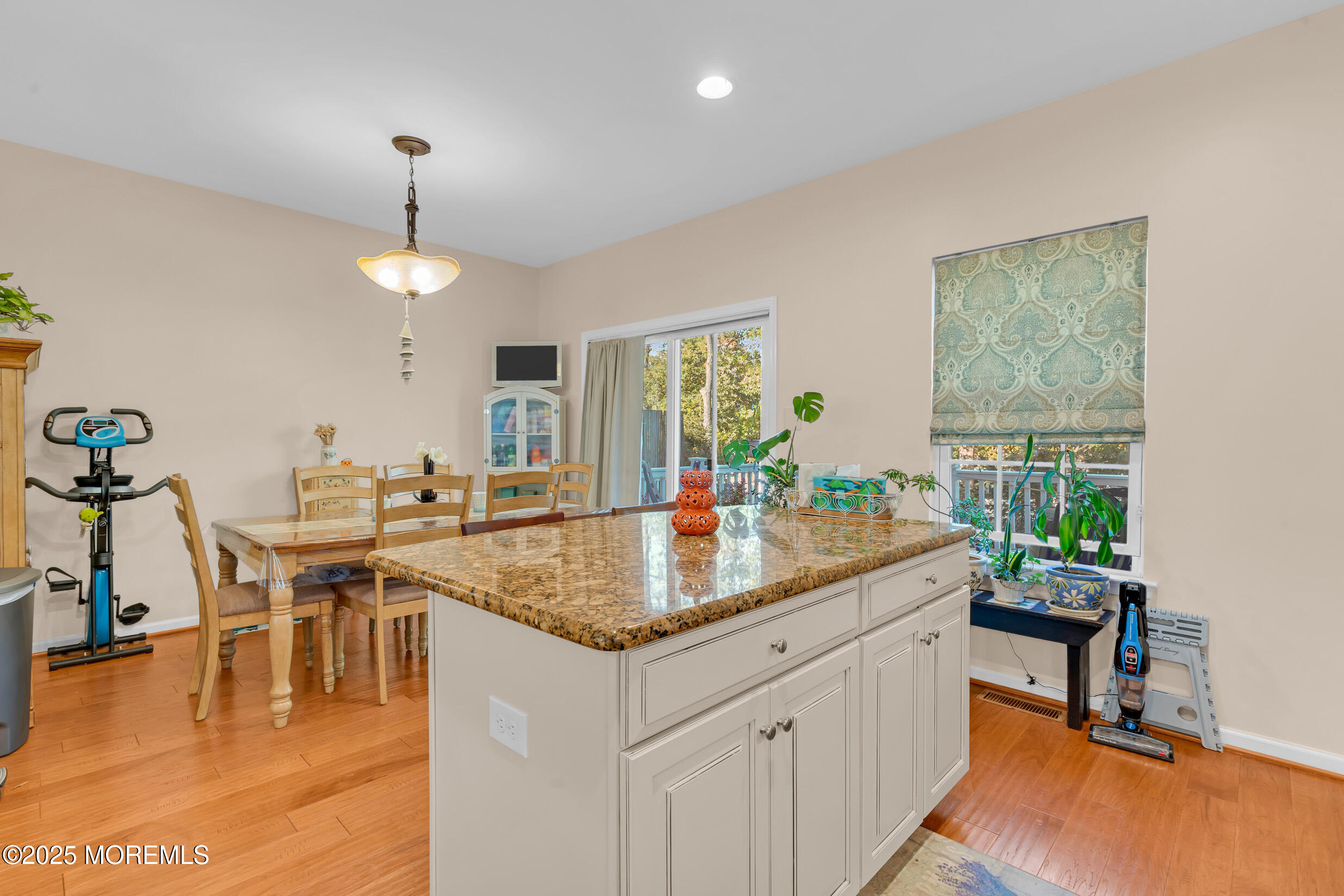111 Spirit Way Brick, NJ 08723 - Photo 10 of 39 a dining table with chairs and chandelier