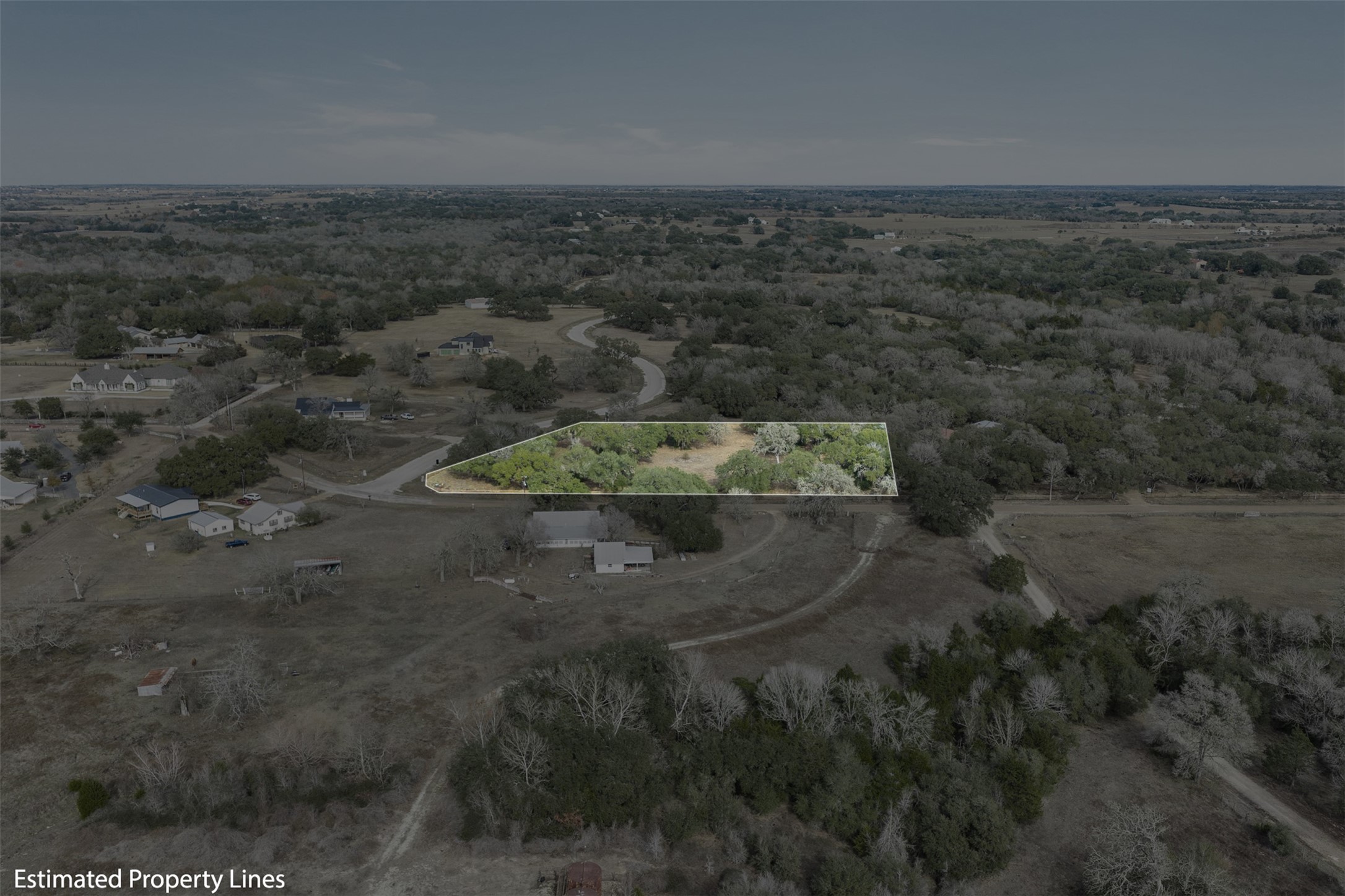 110 Drake Lane Round Top, TX 78954 - Photo 15 of 32 a view of a dry yard with trees