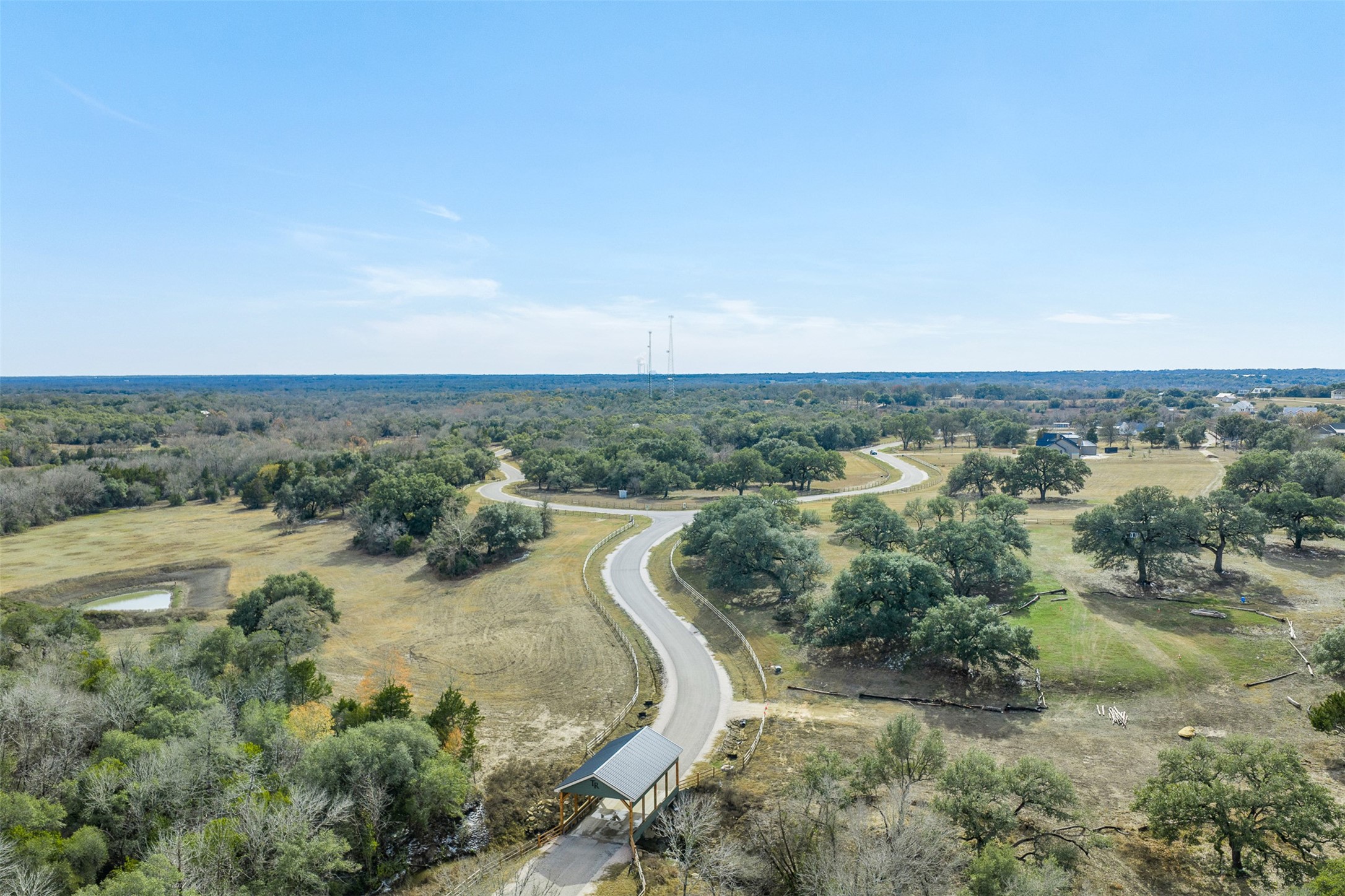 110 Drake Lane Round Top, TX 78954 - Photo 29 of 32 an aerial view of a houses with outdoor space and trees all around