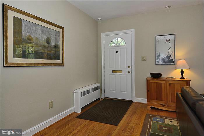 1900 Rookwood Road Silver Spring, MD 20910 - Photo 2 of 30 a view of a bedroom with wooden floor and cabinet