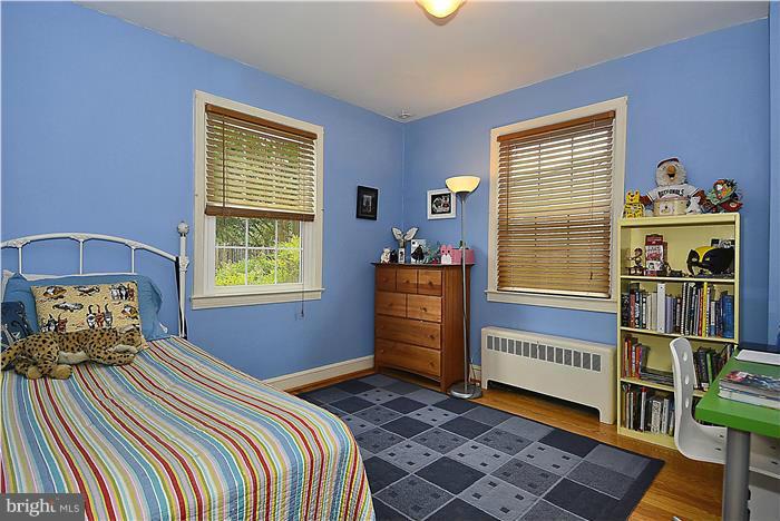 1900 Rookwood Road Silver Spring, MD 20910 - Photo 11 of 30 a bedroom with a bed and a window