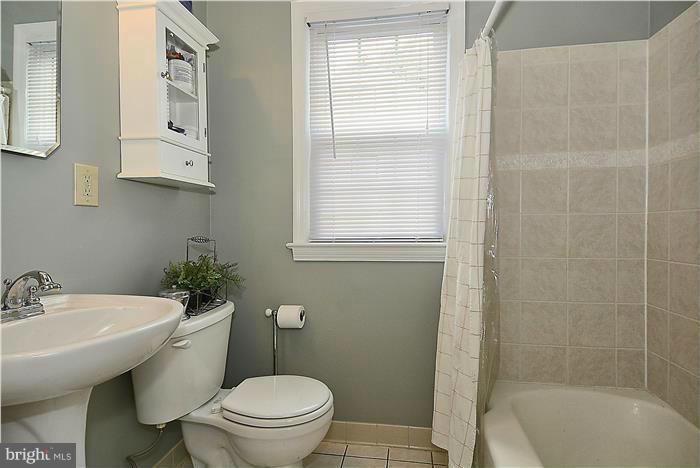 1900 Rookwood Road Silver Spring, MD 20910 - Photo 12 of 30 a bathroom with a sink a toilet and shower