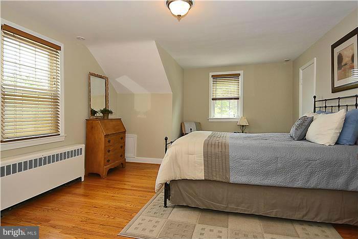 1900 Rookwood Road Silver Spring, MD 20910 - Photo 13 of 30 a bedroom with a bed and a window