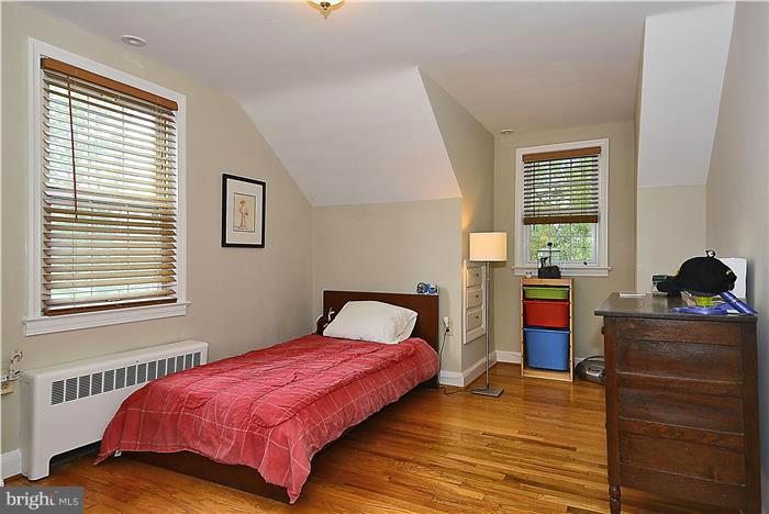 1900 Rookwood Road Silver Spring, MD 20910 - Photo 16 of 30 a bedroom with a bed and wooden floor
