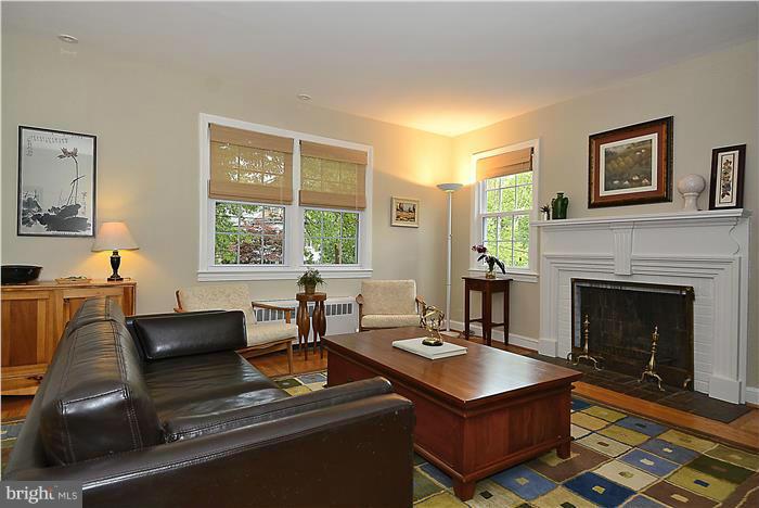 1900 Rookwood Road Silver Spring, MD 20910 - Photo 3 of 30 a living room with furniture a large window and a fireplace