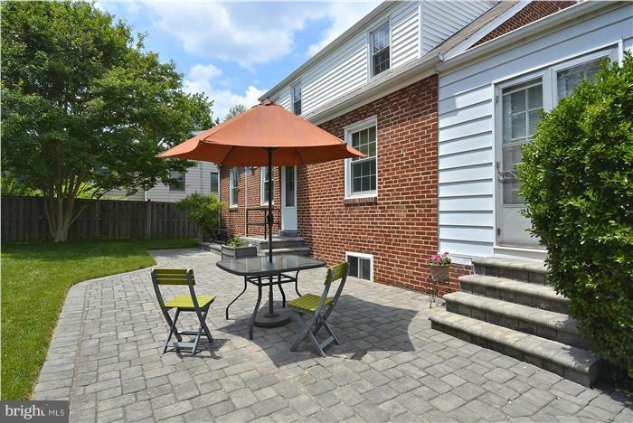 1900 Rookwood Road Silver Spring, MD 20910 - Photo 21 of 30 a view of a patio with table and chairs under an umbrella