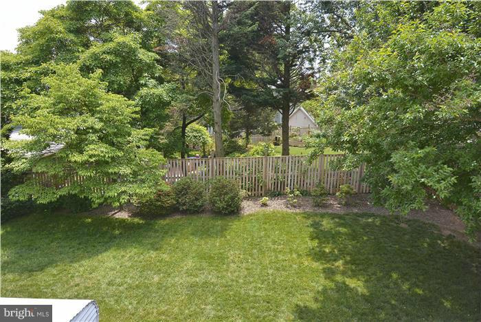 1900 Rookwood Road Silver Spring, MD 20910 - Photo 24 of 30 a backyard of a house with lots of plants and large tree