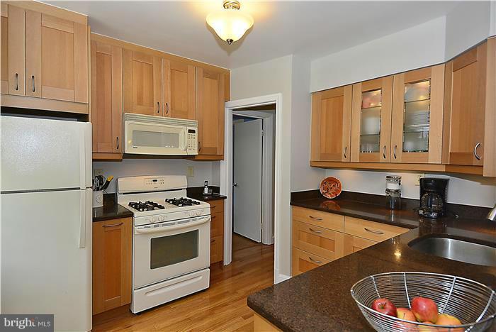 1900 Rookwood Road Silver Spring, MD 20910 - Photo 6 of 30 a kitchen with stainless steel appliances granite countertop a stove a sink and a refrigerator