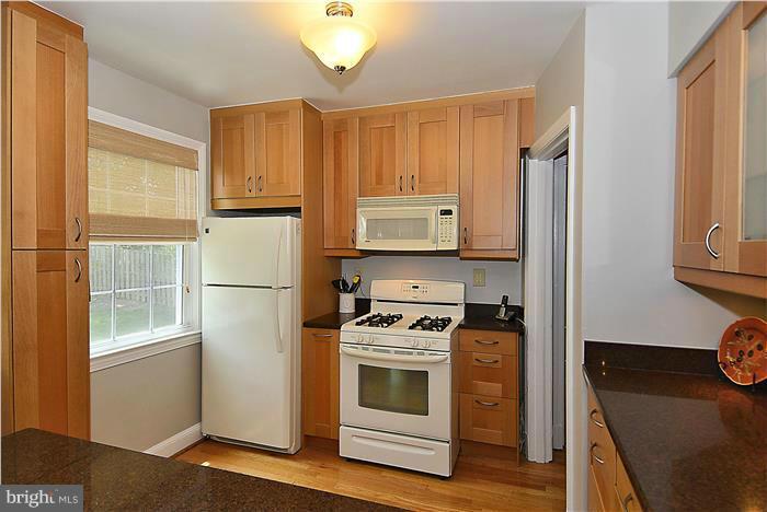 1900 Rookwood Road Silver Spring, MD 20910 - Photo 7 of 30 a kitchen with a stove and a refrigerator