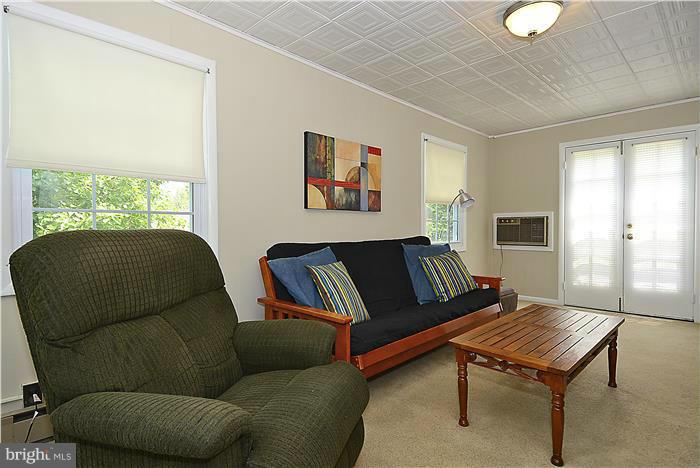1900 Rookwood Road Silver Spring, MD 20910 - Photo 9 of 30 a living room with furniture and a window