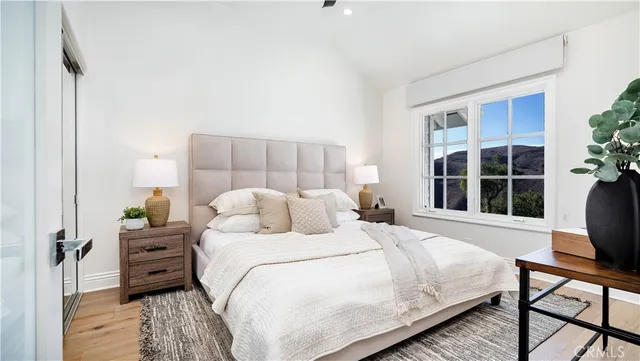 a view of swimming pool with outdoor seating and a garden