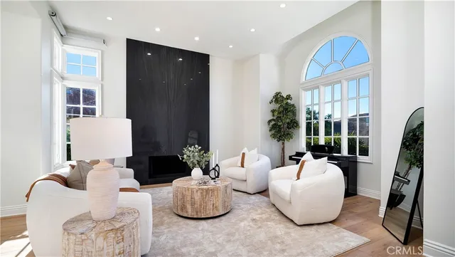 a dining room with stainless steel appliances a dining table and chairs