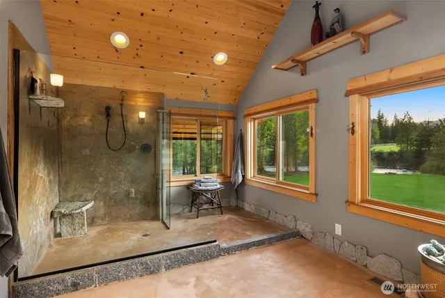 a utility room with stainless steel appliances a sink and a window