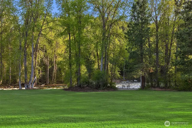 an aerial view of a house with garden space and trees