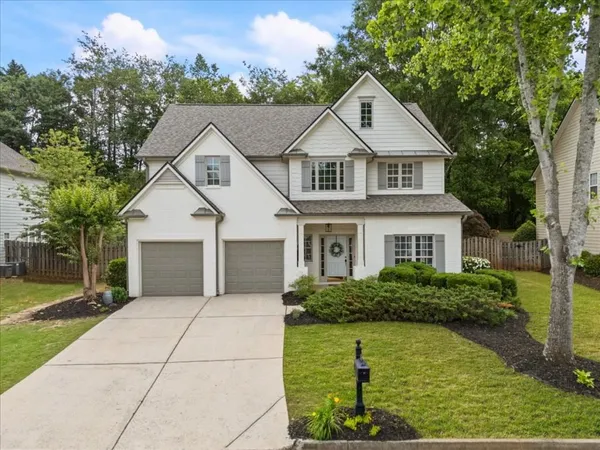 a front view of a house with a yard