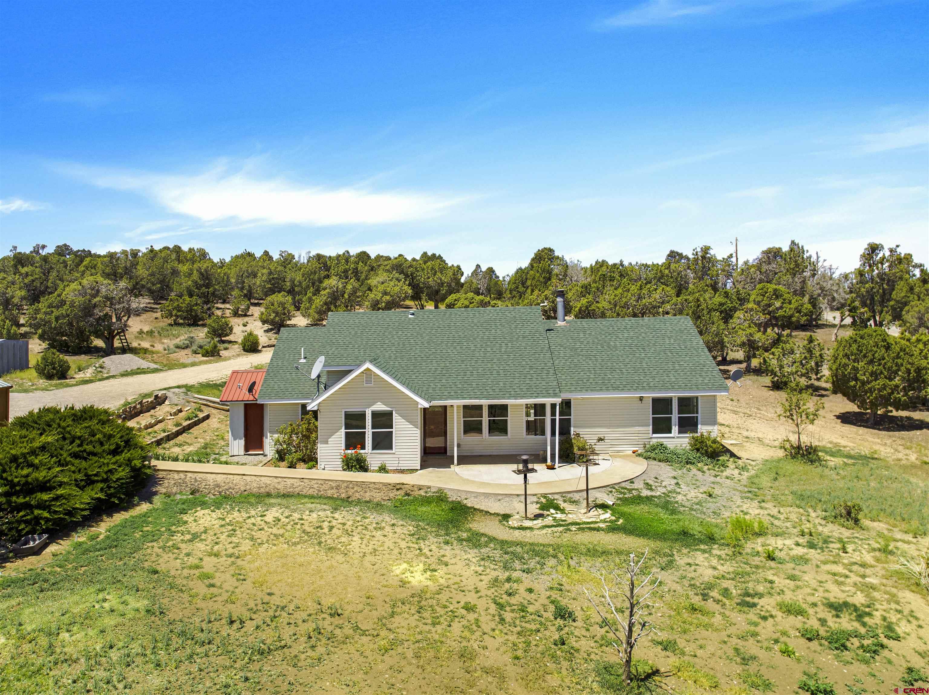 32310 B50 Road Crawford, CO 81415 - Photo 4 of 45 a front view of a house with a yard