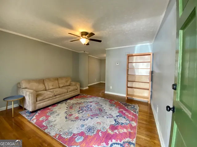a living room with furniture and a rug