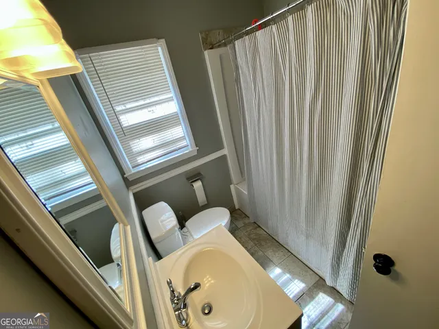 a view of a balcony with furniture