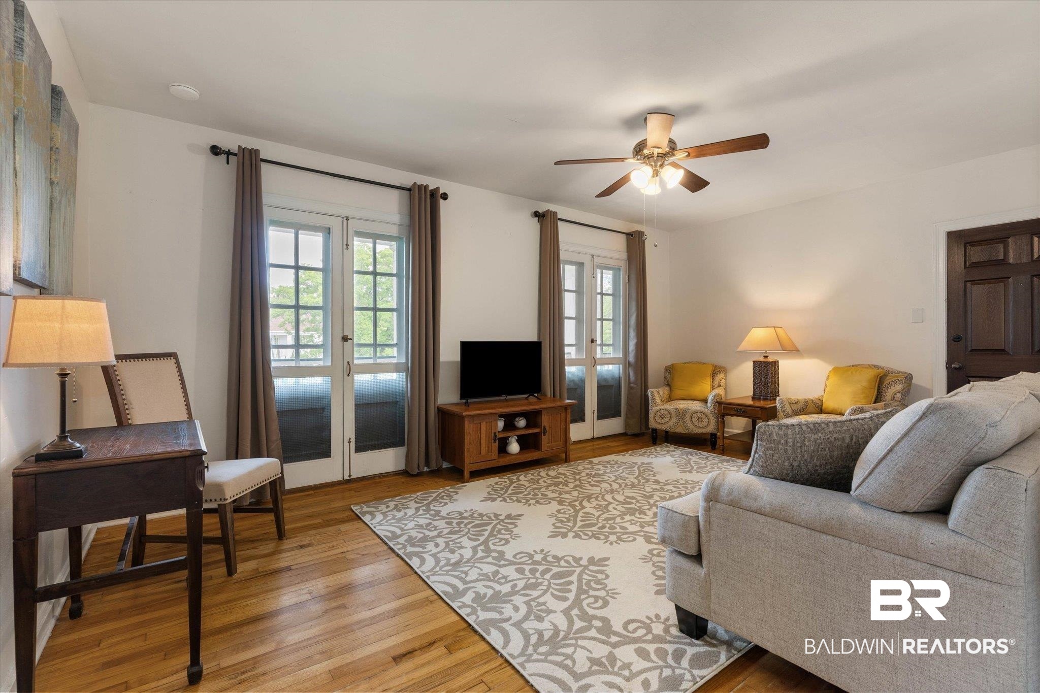 214 Upham Street, Unit 18C Mobile, AL 36607 - Photo 5 of 35 Living room with light wood-style flooring and ceiling fan