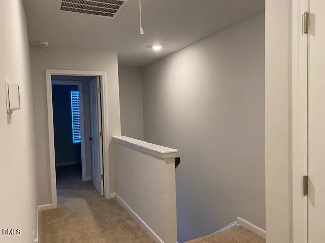 a view of hallway with closet