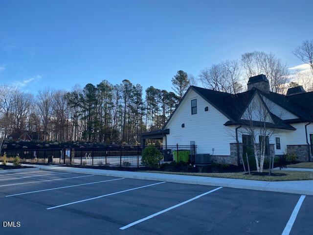 1278 Adrian Court Mebane, NC 27302 - Photo 28 of 33 a view of a white house in a big yard with plants and large trees