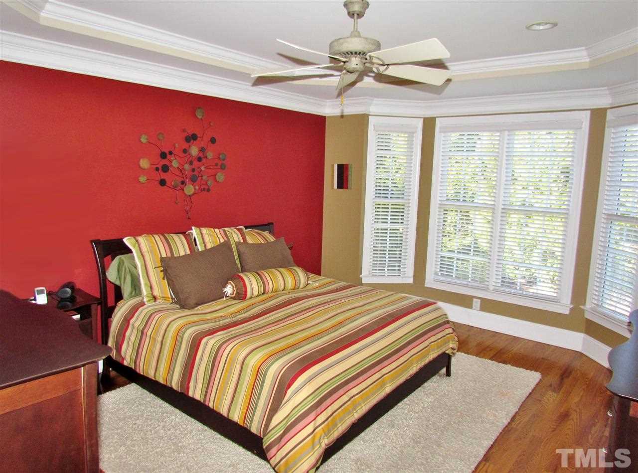 3810 Congeniality Way Raleigh, NC 27613 - Photo 13 of 25 Large 1st floor master w enough room to easily accommodate a Ca. king. Note hardwoods, ceiling fan and blinds.
