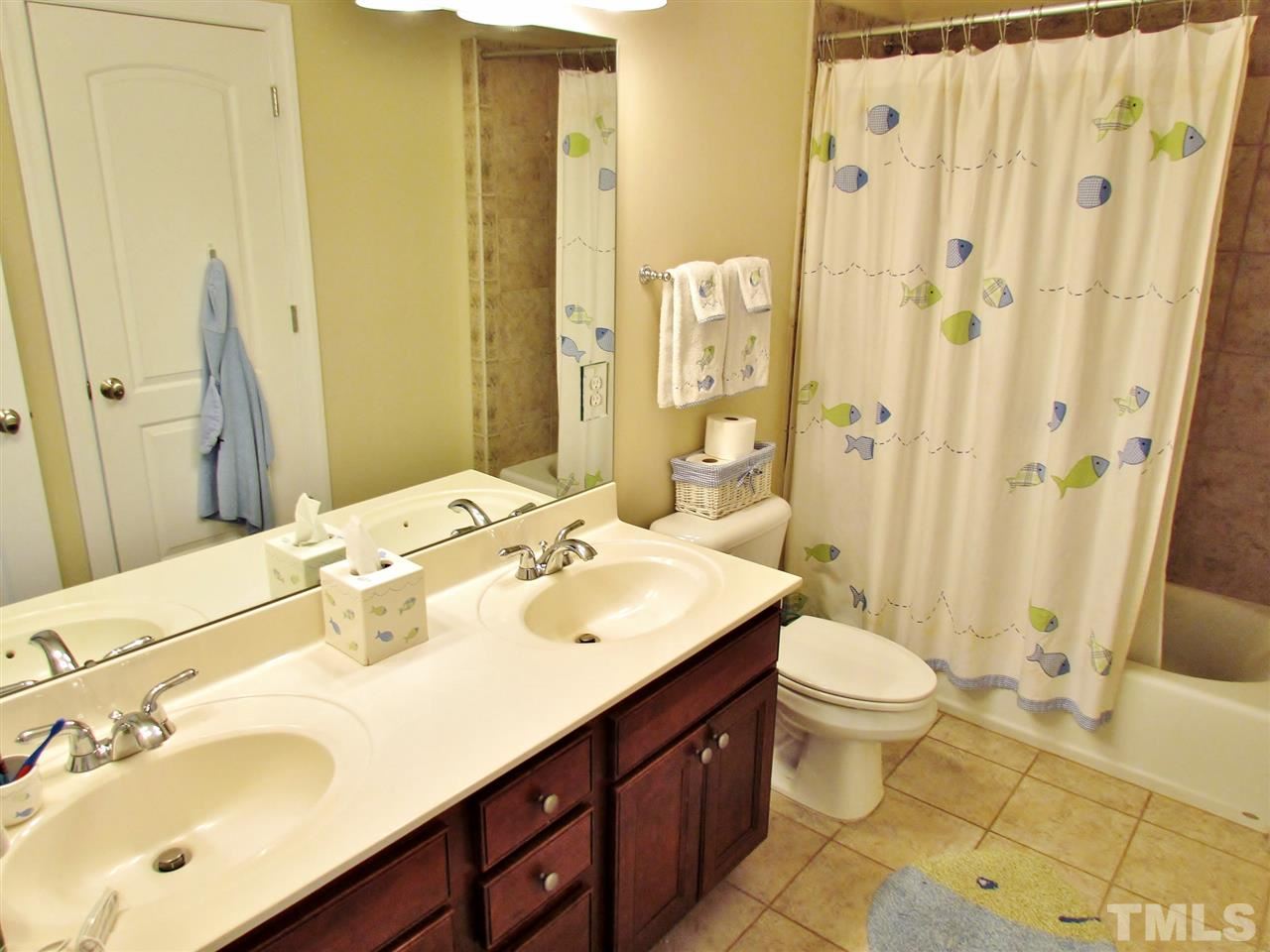 3810 Congeniality Way Raleigh, NC 27613 - Photo 20 of 25 2 floor bathroom. Note dual sinks.