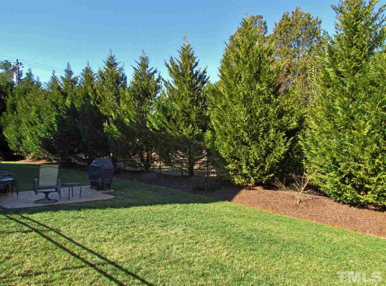 3810 Congeniality Way Raleigh, NC 27613 - Photo 24 of 25 Nice fully fenced private back yard. Perfect for the kids or to hang out and relax. Note stamped concrete patio. Great to create that masterpiece on your grill.