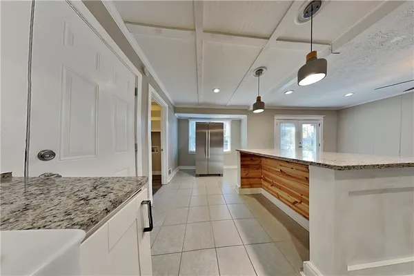 a kitchen with stainless steel appliances granite countertop a sink and cabinets