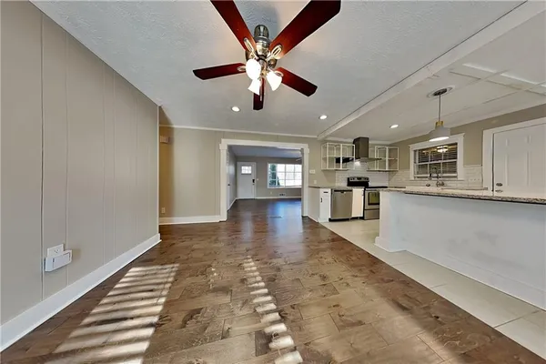 a view of a kitchen with a sink and microwave