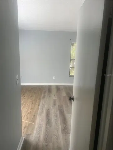 a kitchen with a stove sink and cabinets
