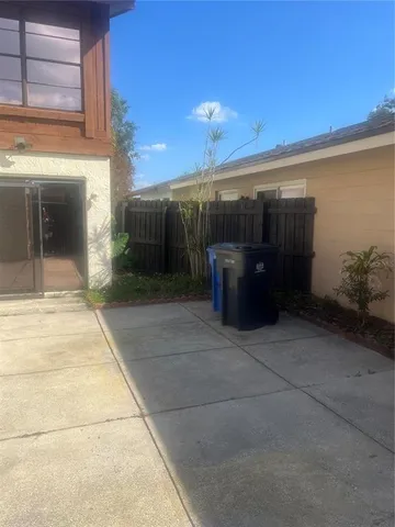 a view of yellow house with a yard