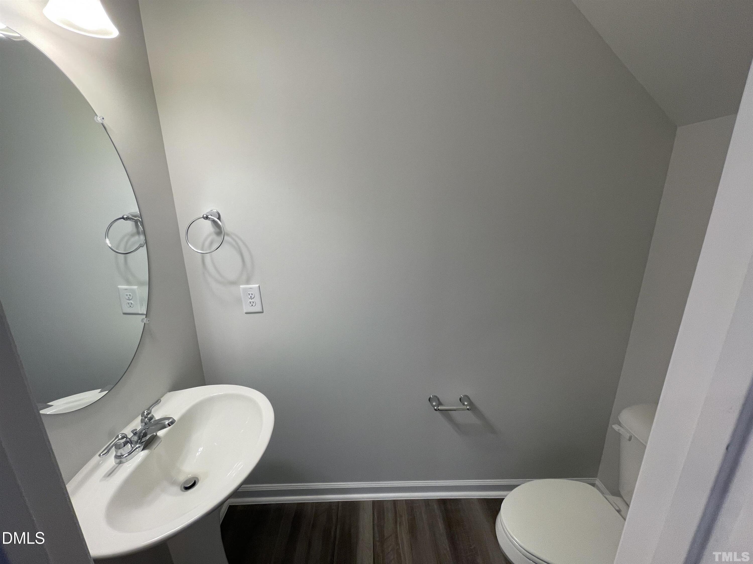 6525 Mezzo Lane Raleigh, NC 27616 - Photo 14 of 38 a bathroom with a sink mirror and toilet