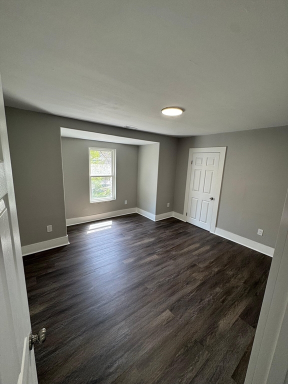 32 Main Street Monson, MA 01057 - Photo 38 of 42 an empty room with wooden floor and windows